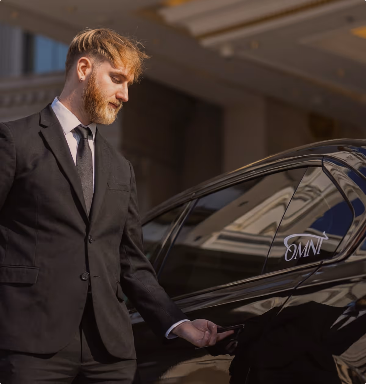 Executive sedan arriving at a corporate office for professional business transport.