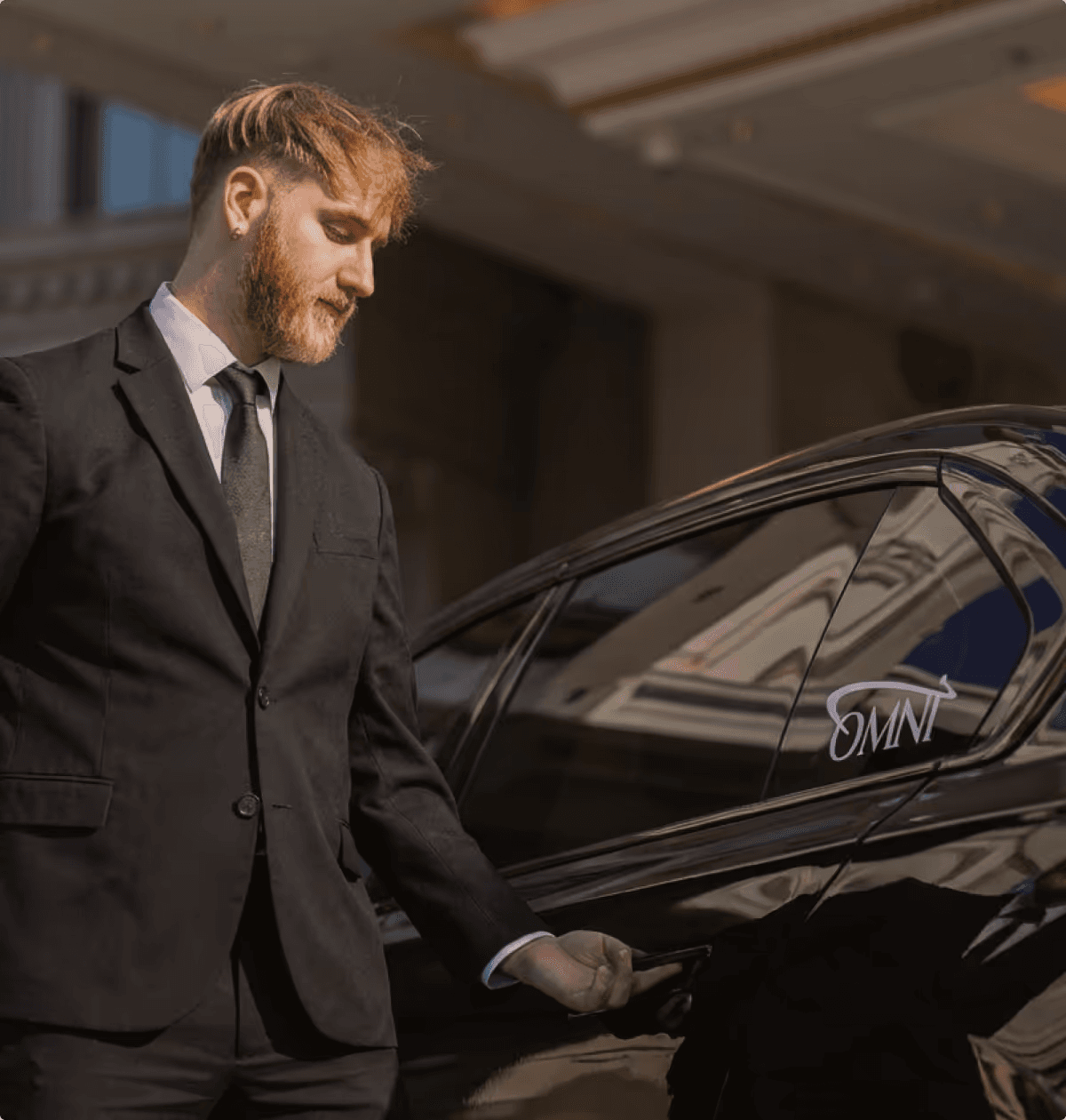 Executive sedan arriving at a corporate office for professional business transport.